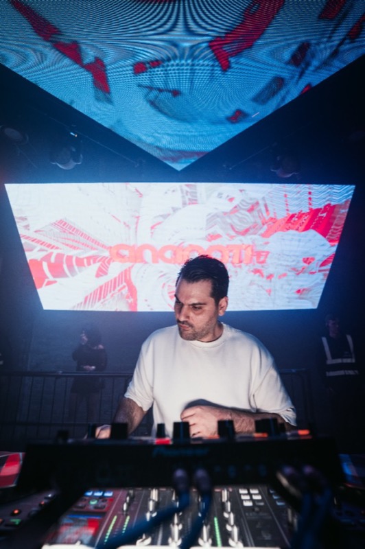 Crowded London nightclub with LED ceiling — Persian DJ party atmosphere