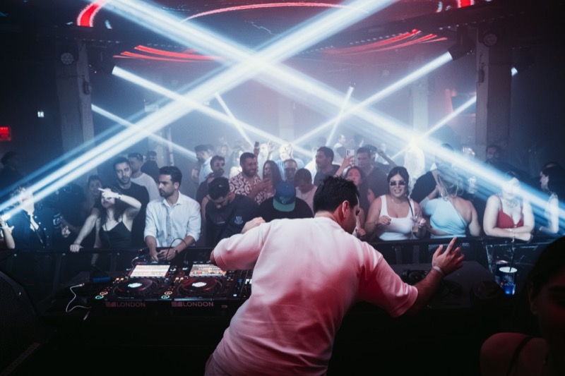 Motion and red club lighting — DJ Cincinati London night photography